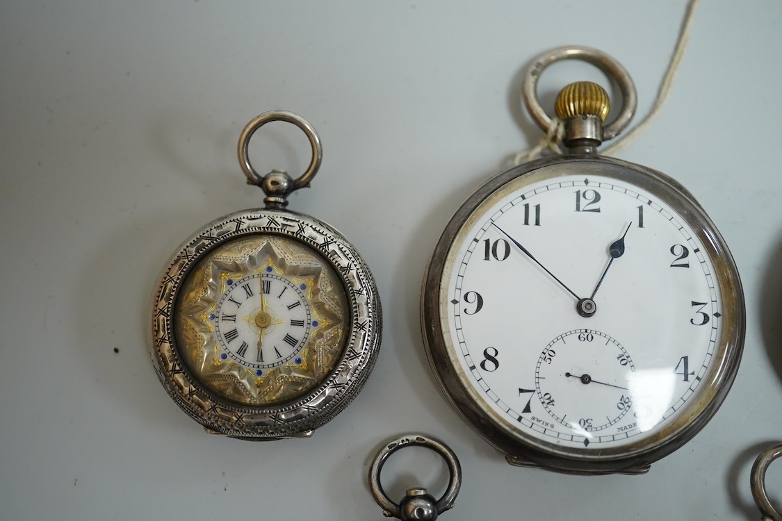An early 20th century silver open faced pocket watch, with Arabic dial and subsidiary seconds, together with four other white metal open faced fob watches and a white metal half hunter pocket watch, case diameter 44mm.
